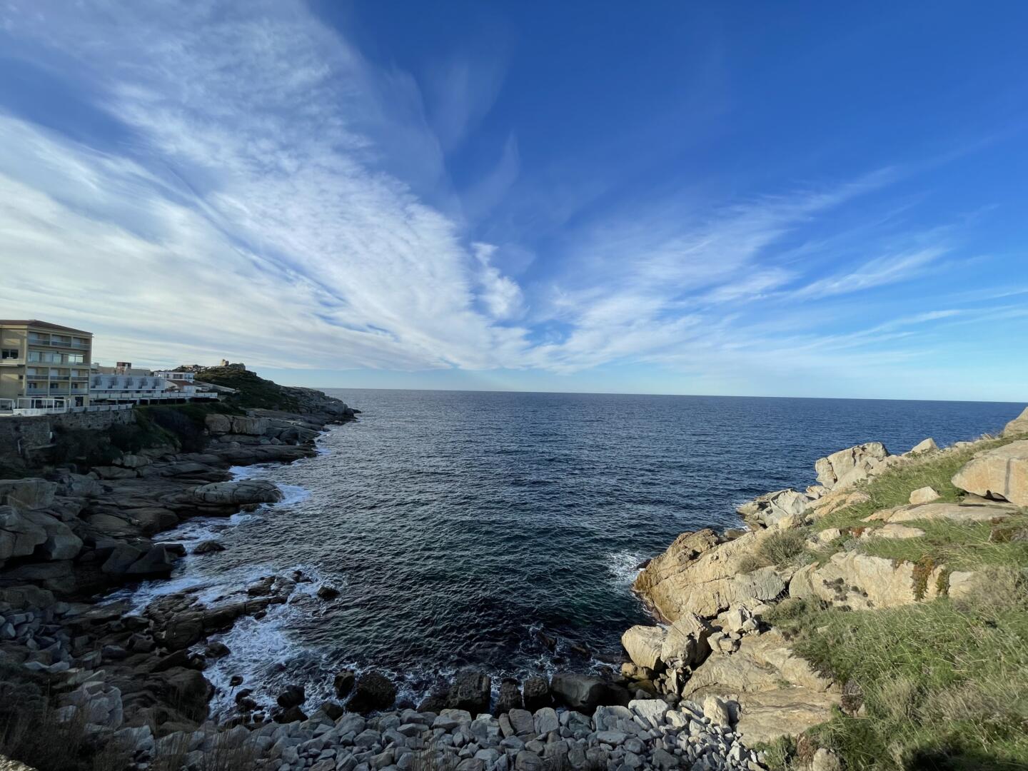 View of the sea and the blue sky of Corsica, in Calvi during winter 2022.