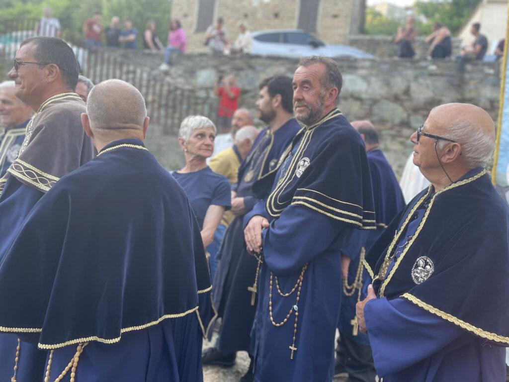 Members of the brotherhood preparing for procession during I Fochi Paoli 2022 in Morosaglia, Corsica.
