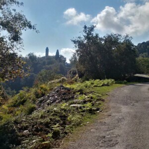 Road in the region of Costa Verde, Corsica. On the background, the church of Santa Lucia di Moriani