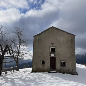 Picture of the chapel of Sant'Alesiu under the snow in Corsica. The chapel is on the top of the mountain behind the village of Valle d'Alesani.